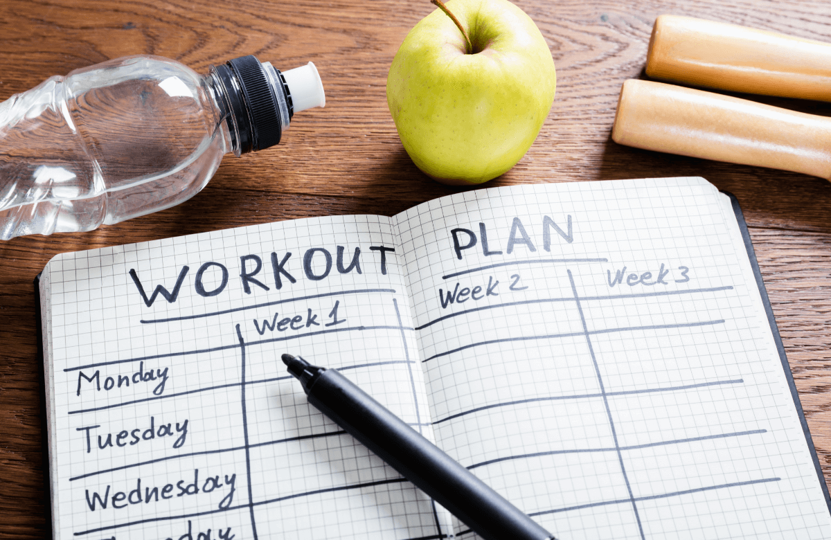 Workout plan written in a notebook
