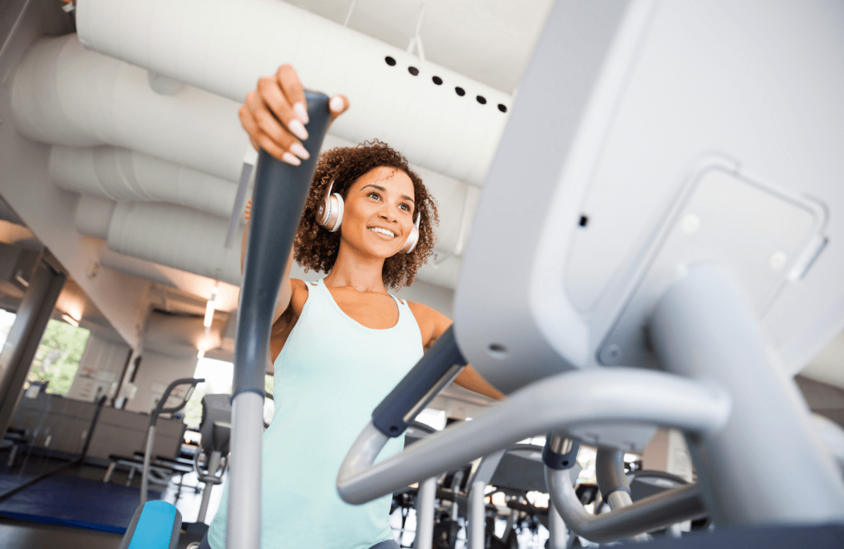 Woman working out on elliptical trainer