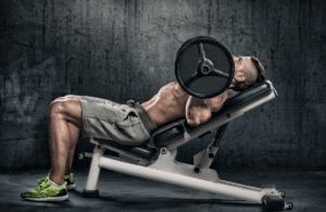 A man does incline barbell press